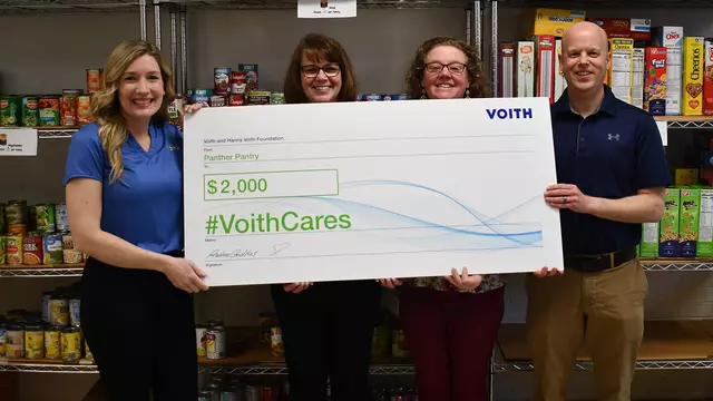 Voith awarded a $2,000 #VoithCares donation to the Panther Pantry, a food pantry operated by teachers and staff in the Central York School District in York, Pennsylvania. (From left to right: Natonia Samchuck, a Voith employee who nominated the nonprofit for the donation; Regina Peckmann, Roundtown Elementary School Teacher; Renee Decker, Roundtown Elementary School Teacher; and Adam Strayer, a Voith employee.)
