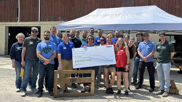 Voith recently awarded a $2,000 #VoithCares donation to the Appleton, Wisconsin chapter of the Sleep in Heavenly Peace nonprofit. The #VoithCares donation was used to fund a bed-building event where employees from Voith Meri Environmental Solutions volunteered their time to build 25 beds for children in need around the Appleton, Wisconsin area. (Pictured from left to right: Front Row: Terry Block, Brad Leitner, and Jodi Sullivan all from Voith Meri Environmental Solutions. Chris Uitenbroek and Wendy Konshak from Sleep in Heavenly Peace. Second Row: Zach Punzel, Alex Swedowski, Adam Rohan, Kasondra Huebner, Sara Traxel, Jakub Mosienski and Brandon Kussow all from Voith Meri Environmental Solutions. Third Row: Vicki McDougall, Tim Hopkins, Zach Coates, Ian Hietpas, Luke Verbruggen, Autumn Sanford, and Joseph Bachmeier all from Voith Meri Environmental Solutions. Back Row: Ryan Mongan and Adam Grosskopf from Voith Meri Environmental Solutions. Not pictured: Jason Kaster and Oressa Kulack, both from Voith Meri Environmental Solutions.)